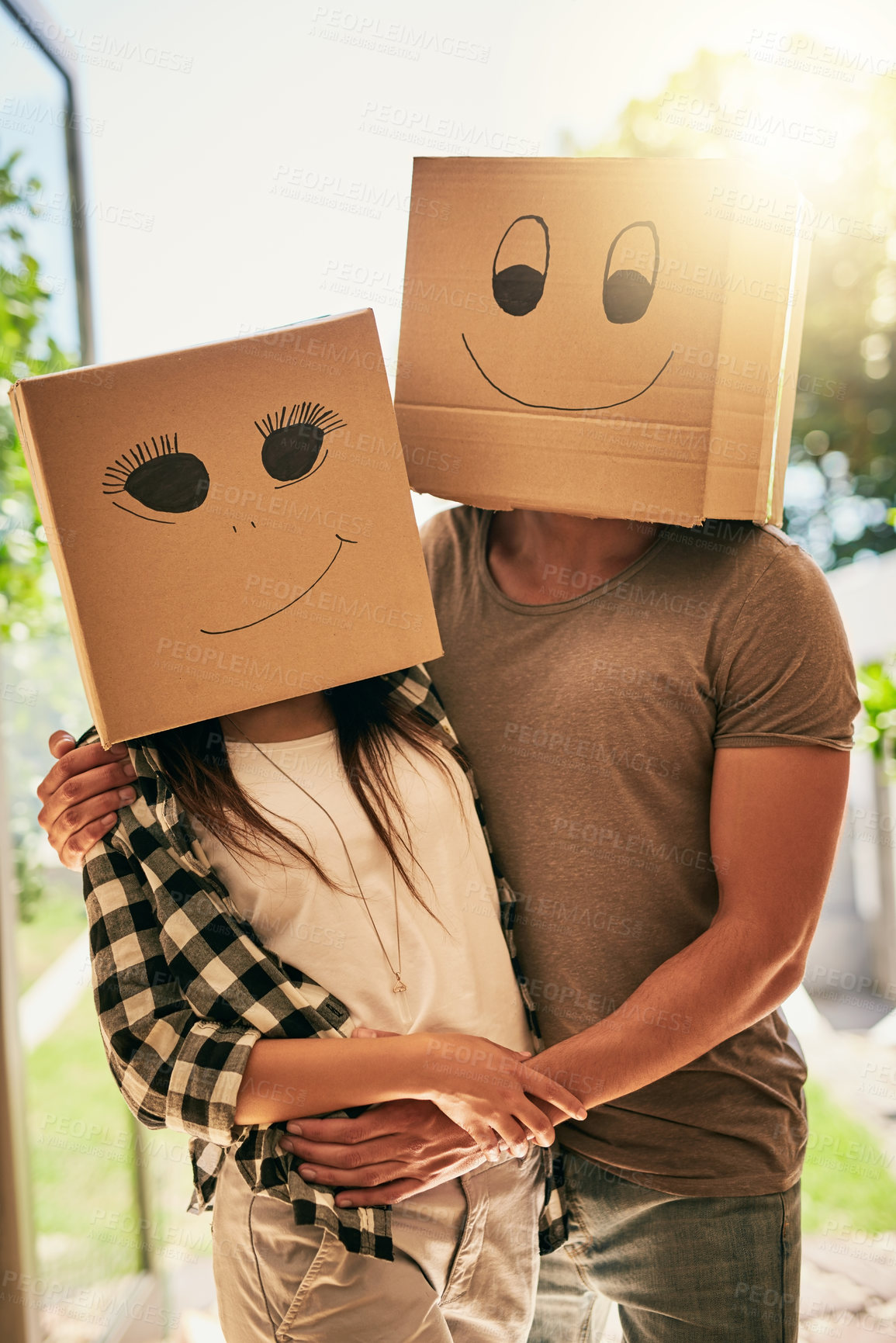 Buy stock photo Couple, fun and cardboard with boxes on head for moving day, comedy renovation and property investment. People, funny drawing and new house with future security, comic celebration and emoji game 