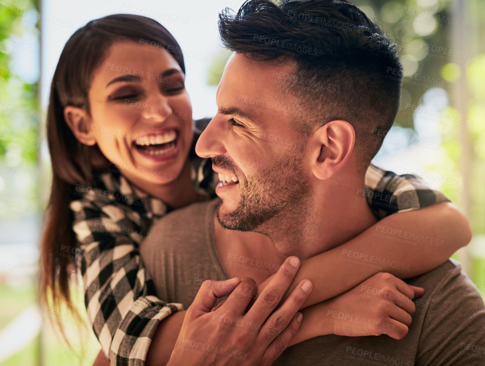 Buy stock photo Shot of an affectionate young couple bonding at home