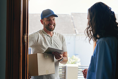 Buy stock photo Shot of a courier making a delivery to a customer at her home