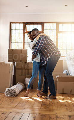 Buy stock photo Shot of a young couple celebrating the move into their new place