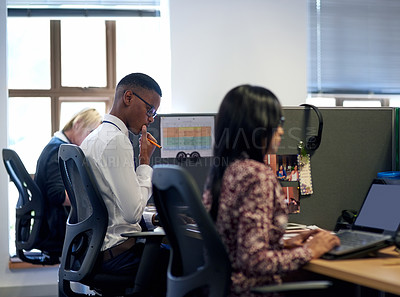 Buy stock photo Shot of businesspeople working in an office