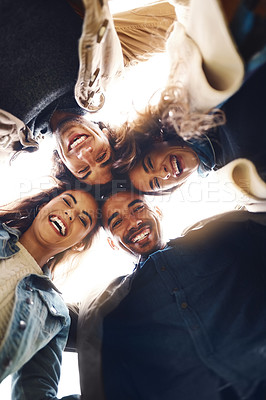 Buy stock photo Low angle, portrait and friends with laughing for hug, connection and bonding together on vacation. Diversity, men and women with huddle embrace for solidarity, support and group of people by below