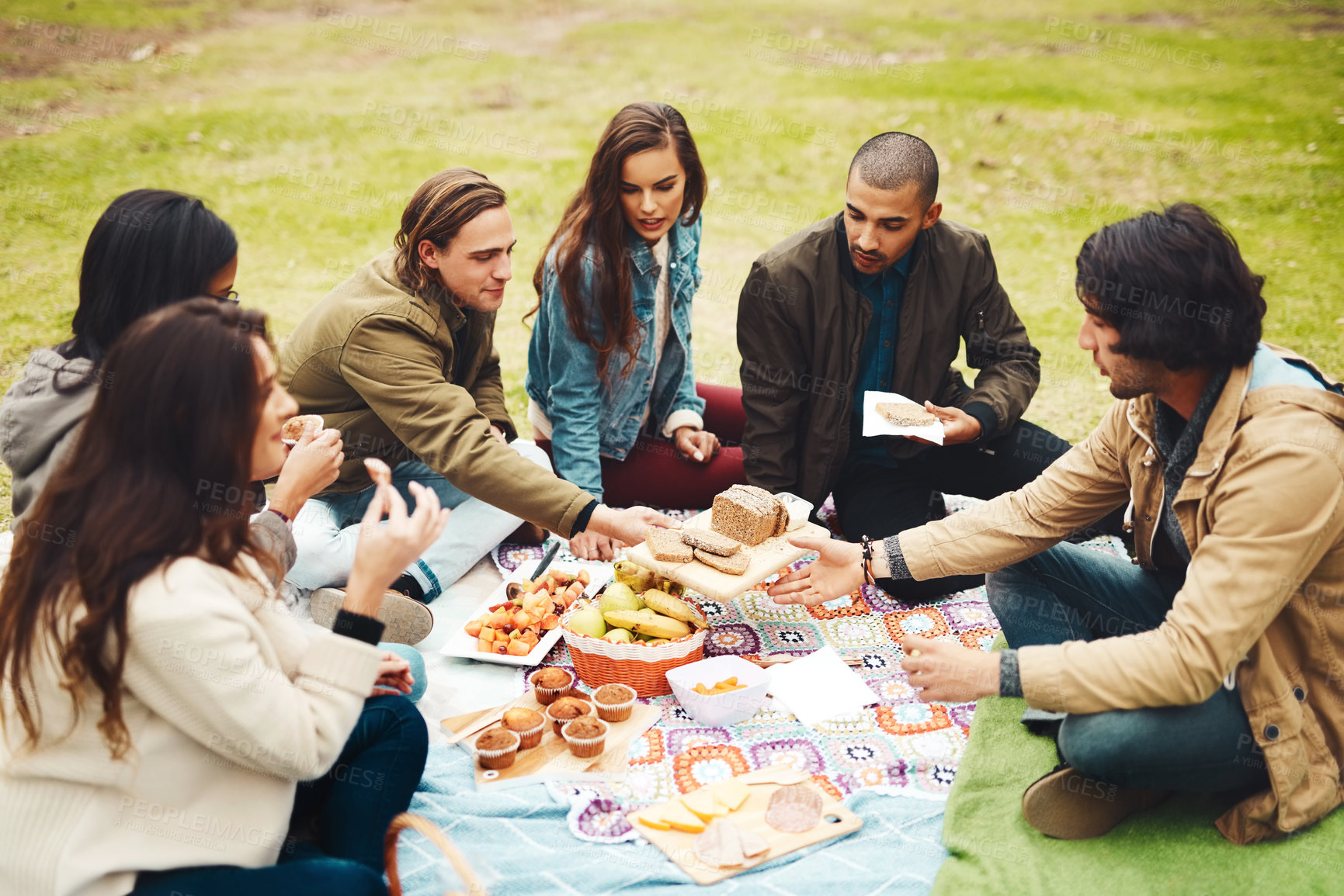 Buy stock photo Group, people or together in park with food for picnic, university students with diversity in community. Friends, inclusion or relax in nature for school reunion or connection, outdoor lunch or party