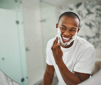 Buy stock photo Black man, foam and happy for shaving, grooming and cosmetics in mirror for self care in home. Young african guy, soap or cream for facial hair, beard and cleaning for hygiene with smile in morning