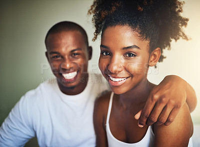Buy stock photo Portrait of a happy young couple spending time together in the morning at home