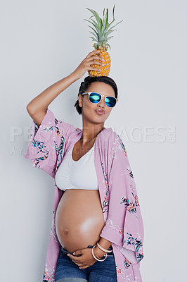 Buy stock photo Studio, portrait and pregnant woman with pineapple for holding, nutrition and growth for baby development. Excited, female person and pout by white background for pregnancy, motherhood or detox fruit