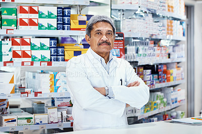 Buy stock photo Portrait of a mature pharmacist working in a chemist
