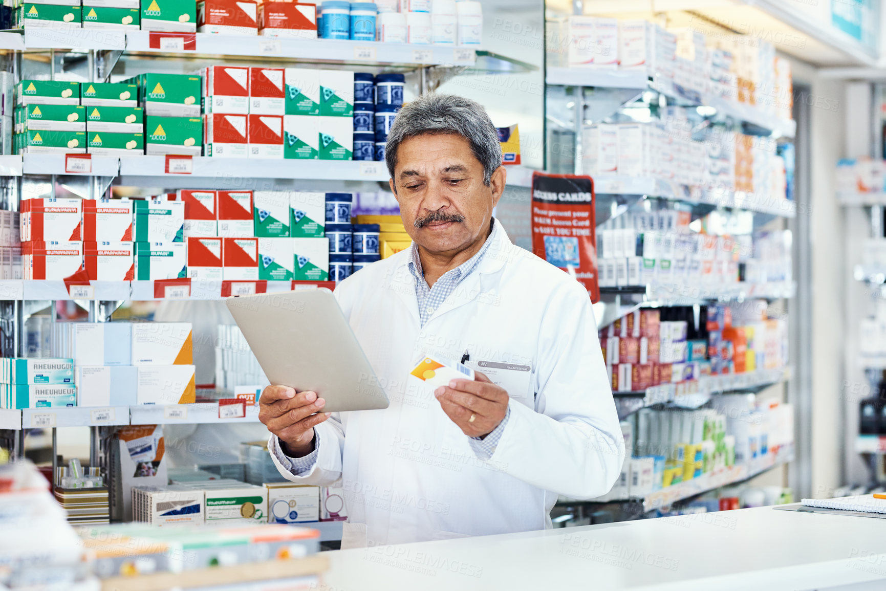 Buy stock photo Pharmacy, pills and pharmacist online with tablet for patient profile, records and inventory or stock management. Mature man, technology and internet for compliance documentation and order research.