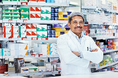Buy stock photo Portrait of a mature pharmacist working in a chemist