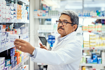 Buy stock photo Pharmacist, tablet and pills in stock, inventory and medicine as chemist, drugstore and employee. Man, doctor and digital checklist in pharmacy, clinic or dispensary for prescription, help or advice
