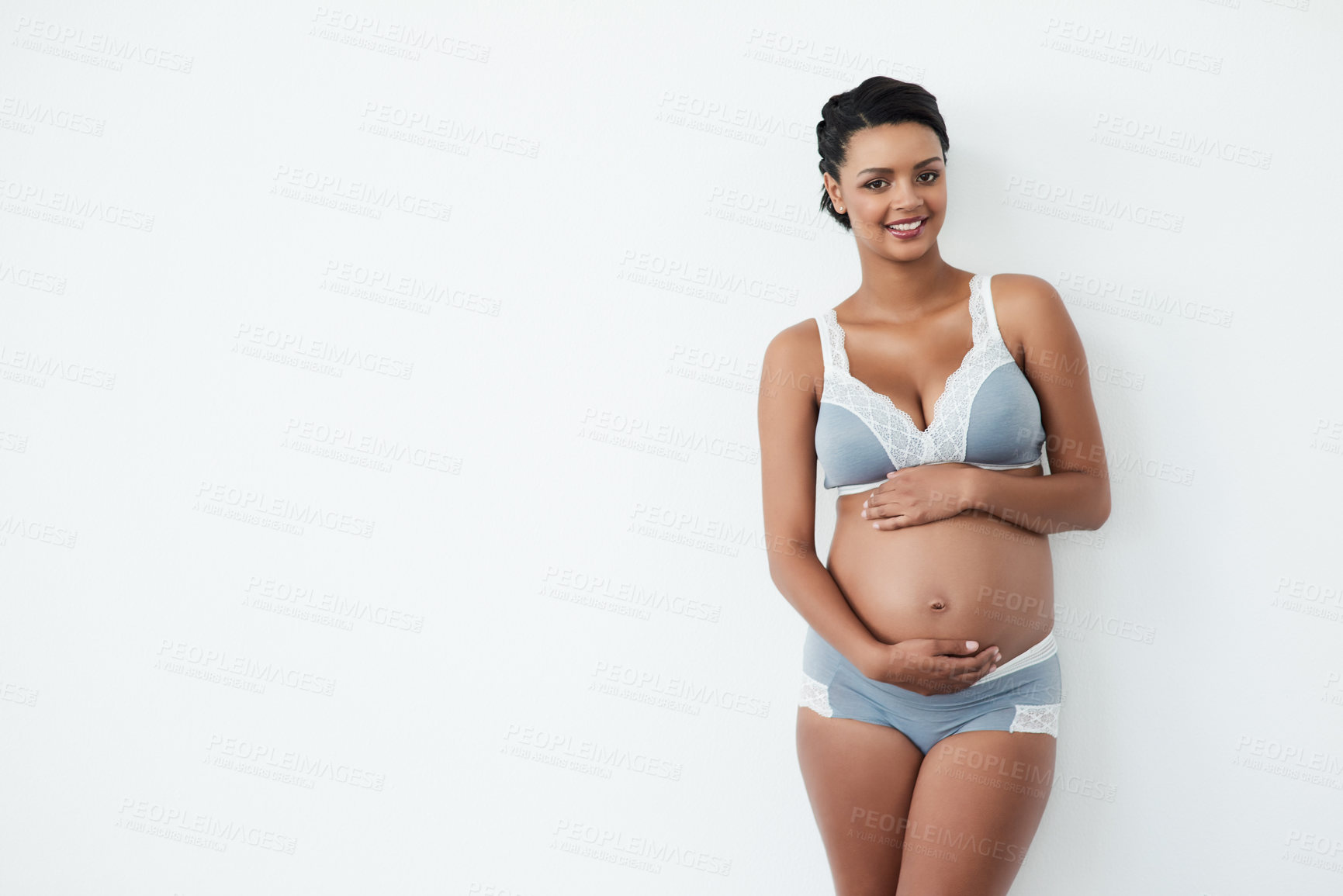 Buy stock photo Pregnancy, happy and portrait of woman in studio with stomach for love, care and maternity. Pregnant, mockup space and isolated person with belly for health, wellness or fertility on white background