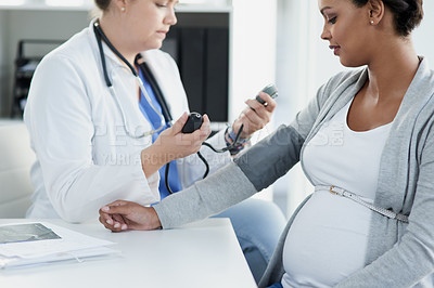 Buy stock photo Blood pressure, gynecology and doctor with a pregnant woman for a consultation of health. Hospital, wellness check and a medical worker with a patient consulting about hypertension during pregnancy