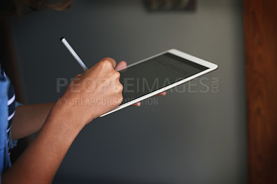 Buy stock photo Closeup shot of an unrecognizable woman using a digital tablet