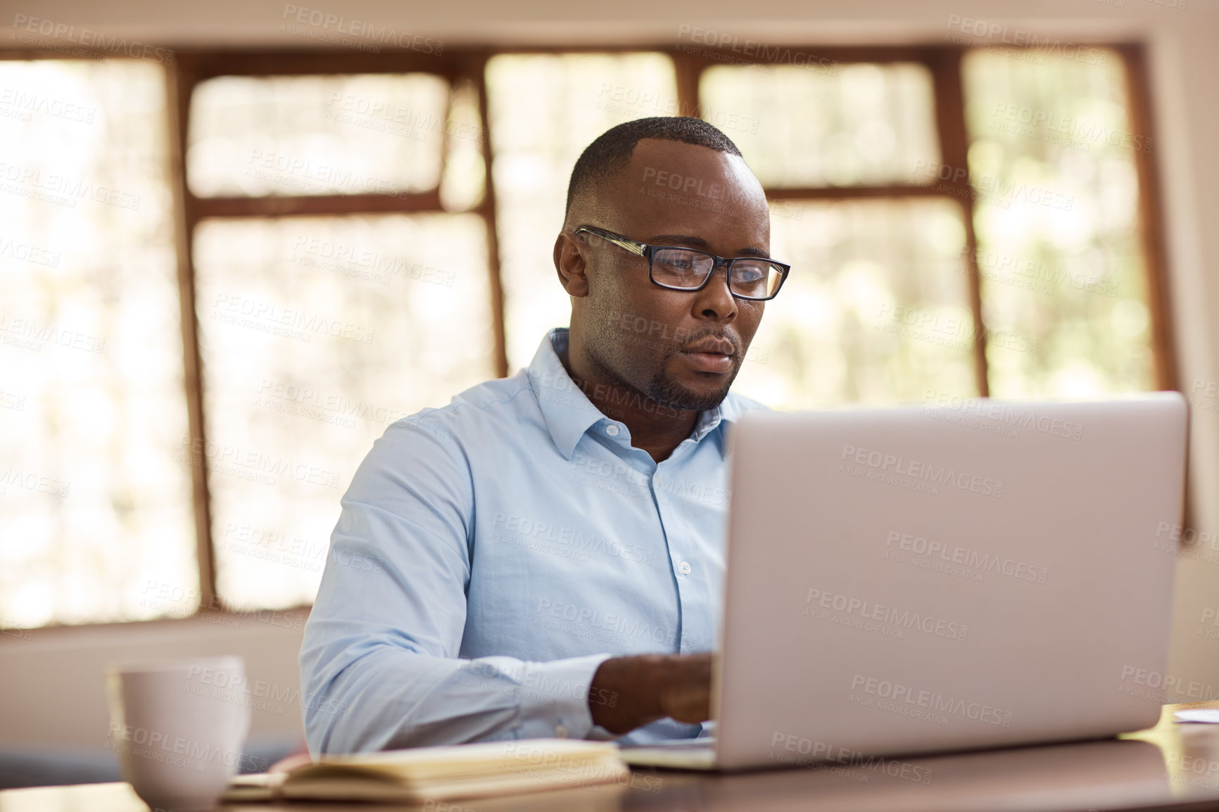 Buy stock photo Black man, glasses and laptop for remote work at house with financial planning, review budget and schedule. Person, typing and online for accounting, audit report and investment funding with project