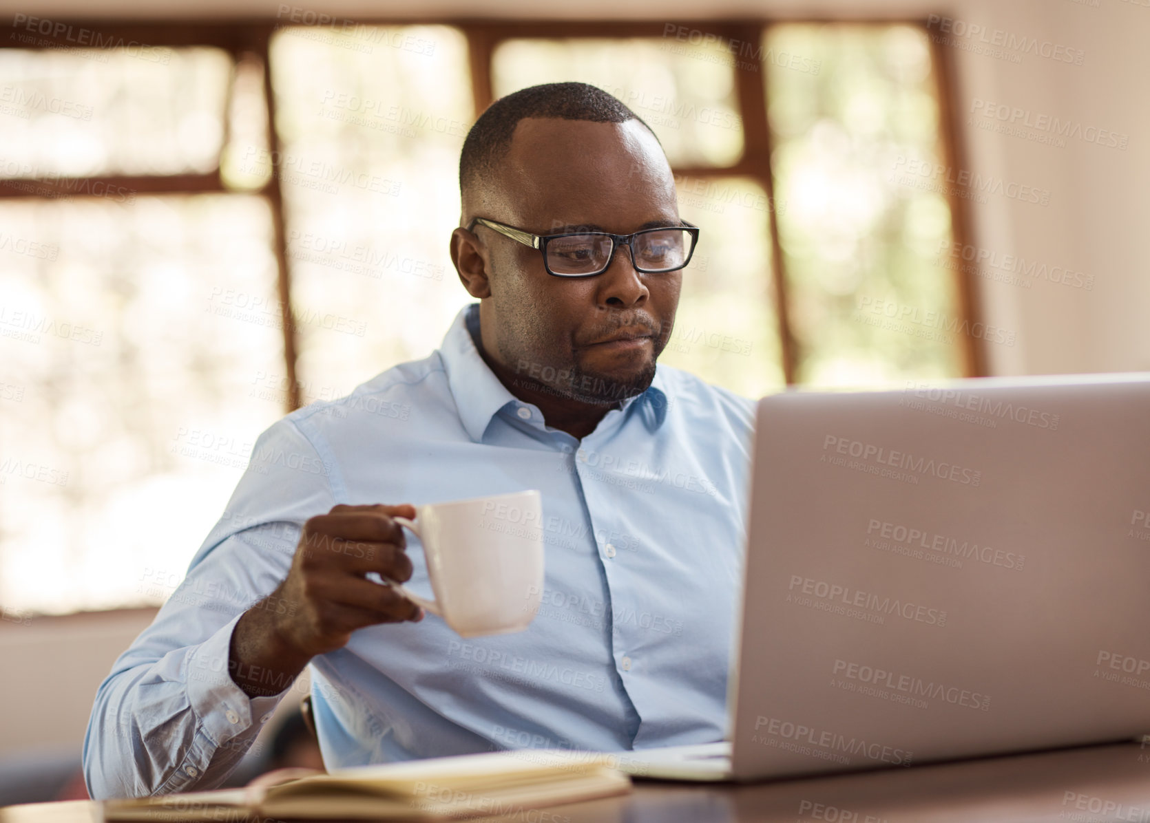 Buy stock photo Black man, typing and laptop with coffee at house for financial planning, review budget and schedule. Male person, online and accounting research, audit report and investment funding for project goal