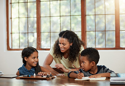 Buy stock photo Education, children and mother with girl, boy and doing homework or learning on a dining room table or parent and together. Family, home and school with mom teaching her daughter or son and indoors