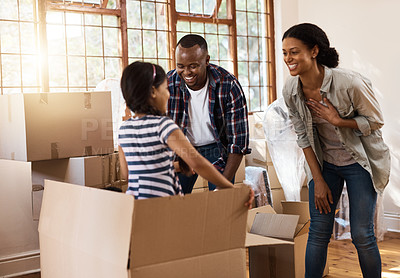 Buy stock photo Shot of a family having fun while moving house