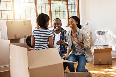 Buy stock photo Shot of a family having fun while moving house