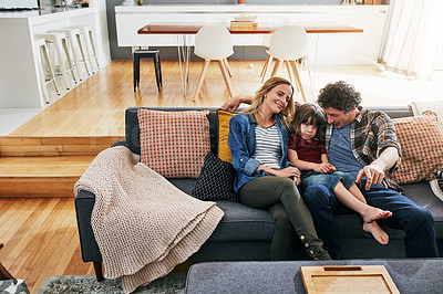 Buy stock photo Cropped shot of an affectionate family of three relaxing on the sofa at home