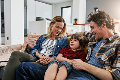 Buy stock photo Mom, dad and happy family relax on sofa in living room with love, quality time and chat together at home. Young boy, cute child and bonding with parents in lounge for support, happiness and care 