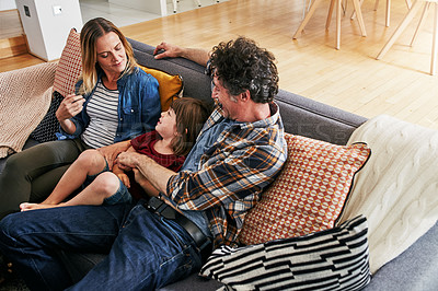Buy stock photo Mom, dad and kid relax on couch in living room for love, care and quality time together in happy family home. Young boy, child and loving parents in lounge for support, bonding and happiness on sofa