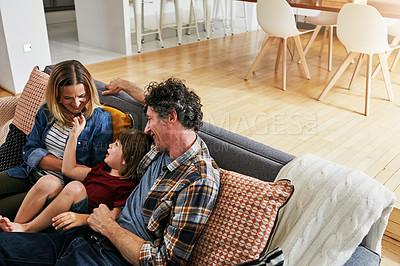 Buy stock photo Happy family, parents and playing with child on sofa in living room for love, quality time and relax together at home. Mother, father and boy kid in lounge for support, care and bonding for happiness