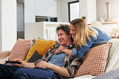 Buy stock photo Happy couple, hug and watching tv in home for movie, film show and news broadcast in living room. Mature man, woman and smile on sofa for television series, video subscription and streaming platform