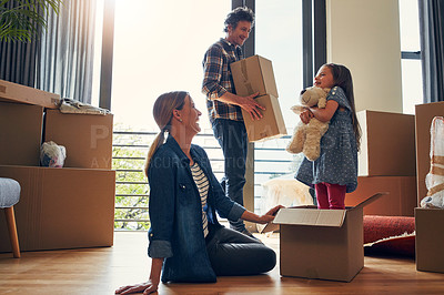 Buy stock photo Happy, boxes and parents with child in new home bonding together for family time with teddy bear. Laugh, moving and girl kid play with mom and dad for fun and unpacking cardboard package for house.