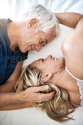 Buy stock photo Above, mature or happy couple lying in bed in home for marriage, commitment and loyalty to partner. Man, woman and senior people resting for support with romance, care and trust for bonding together