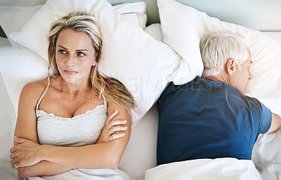 Buy stock photo Shot of a mature couple having marital problems at home