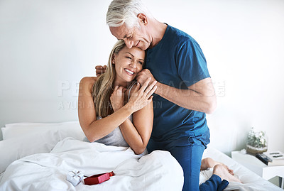 Buy stock photo Necklace gift, hug or happy couple in bed for anniversary, fancy jewelry or romantic love gesture in home. Happy woman, mature man or birthday present with smile for honeymoon, thank you or marriage