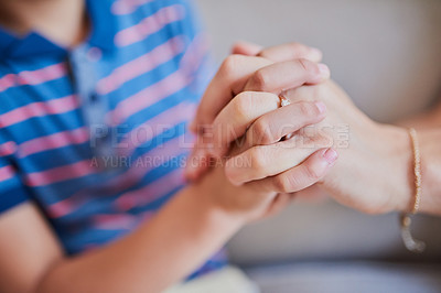 Buy stock photo Closeup shot of a mother and son holding hands at home