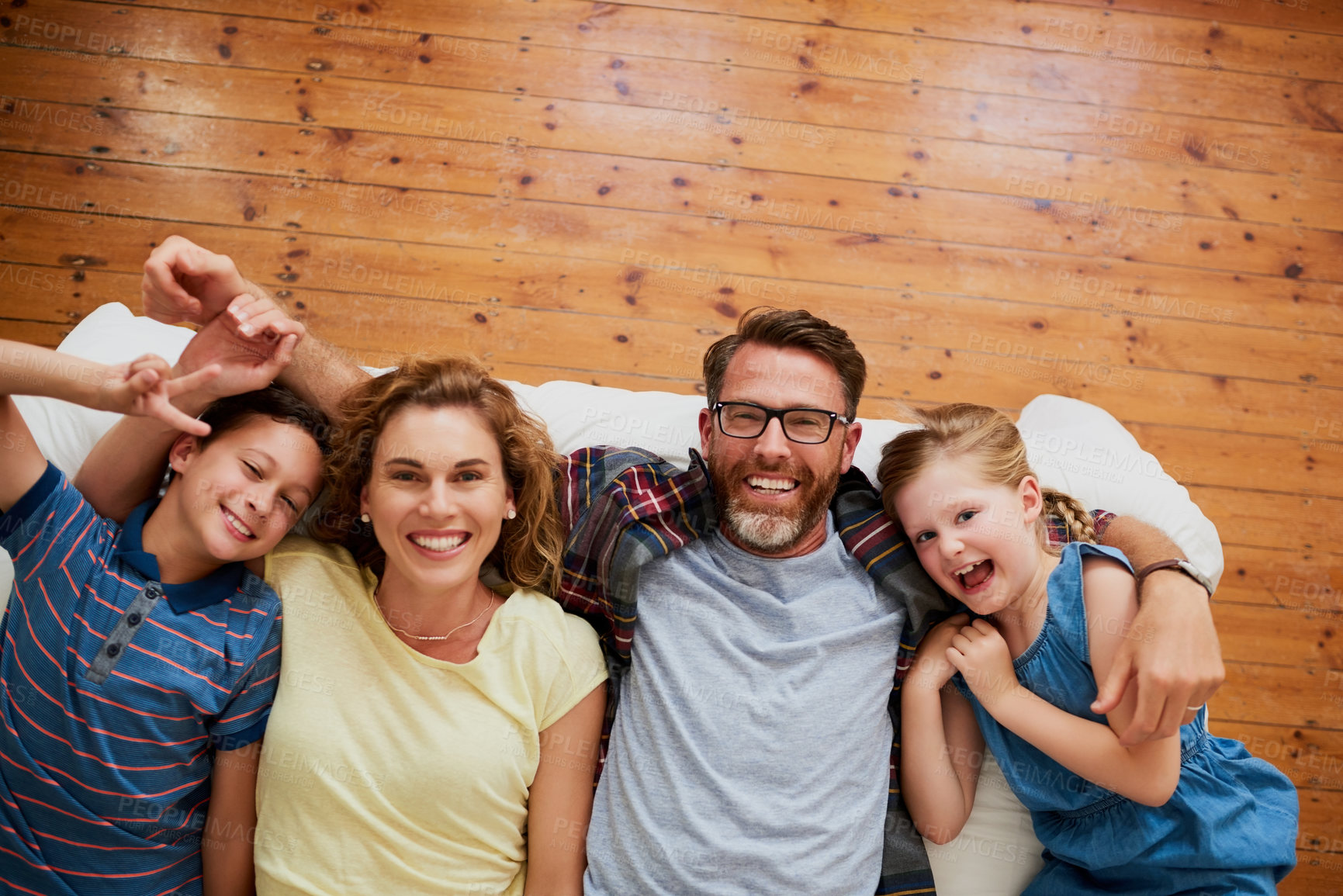 Buy stock photo High angle shot of an affectionate family at home