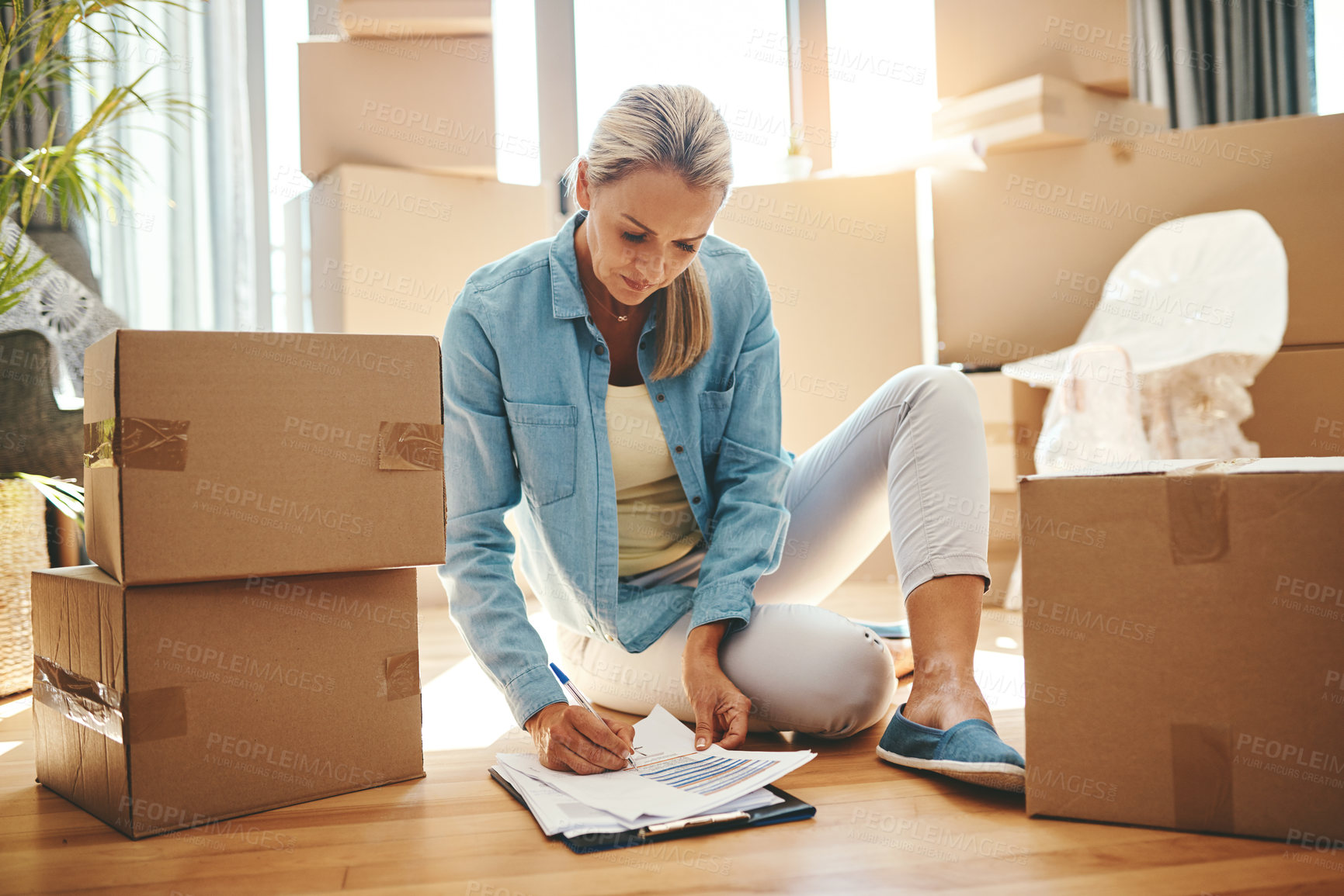 Buy stock photo Woman, paperwork and boxes in apartment on the floor for investment in real estate for house. Document, lease and person with agreement for new home in living room with rent for property and growth.
