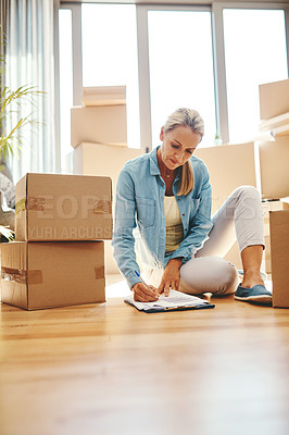 Buy stock photo Woman, boxes and sign paperwork in the living room for investment with a contract. Investing, document and writing on the floor with a lease at a new home for retirement and finance for savings.