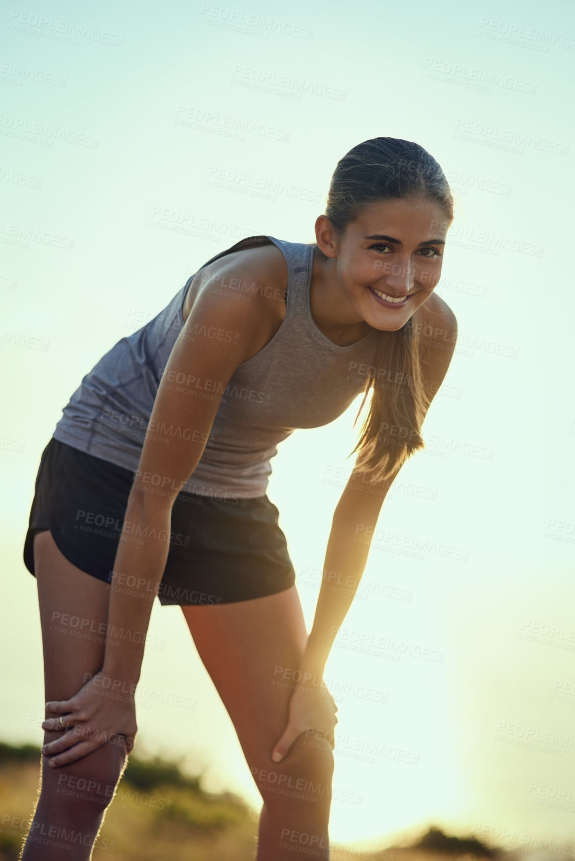 Buy stock photo Portrait of a young woman taking a break while out for a run