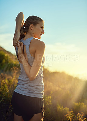 Buy stock photo Fitness, woman and stretching arms outdoor to start exercise, back workout or training healthy body. Runner, flexibility and warm up at sunset to prepare for marathon, sports and ready for wellness