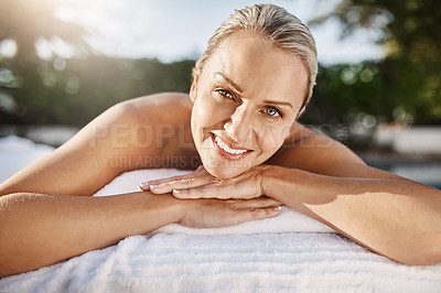 Buy stock photo Happy woman, portrait and relax with bed at spa for massage, facial or treatment at outdoor resort. Female person with smile lying on table for relaxation, zen or physical therapy at luxury salon