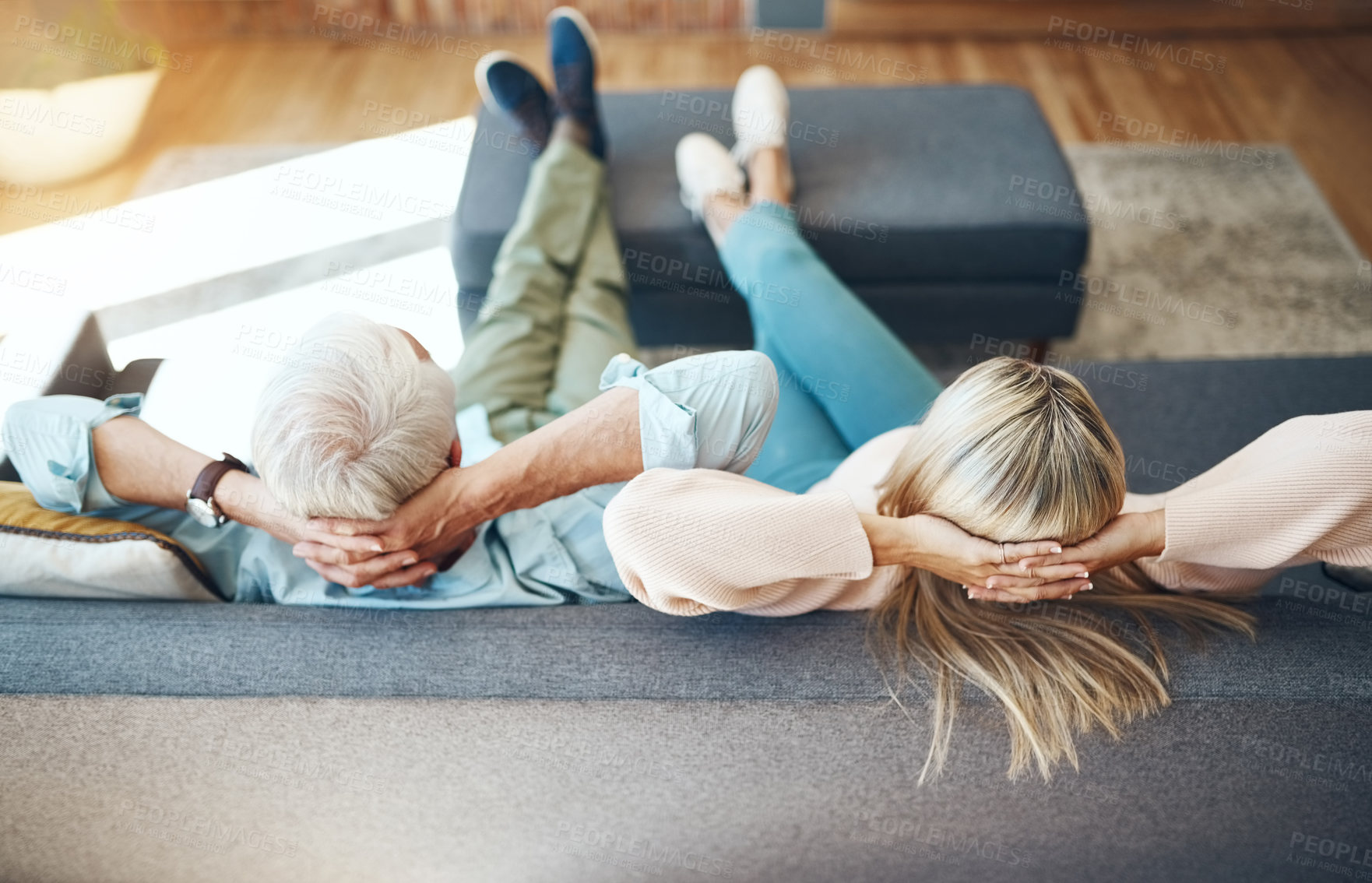 Buy stock photo Back, couple and relax on sofa in home for peace, calm or stress relief together in living room. Mature man, woman and rest on couch for comfort, leisure and people chill or dream on weekend at hotel