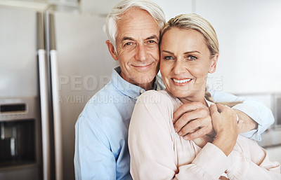 Buy stock photo Cropped portrait of an affectionate mature couple in their home