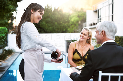 Buy stock photo People, waitress and couple with smile for wine in outdoor at resort for catering, hospitality and romantic meal. Love, relationship and food for fine dining or date and satisfied with service