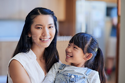 Buy stock photo Mother, girl and portrait in home with hug for bonding, support and relationship together as family. Asian mom, daughter and face in living room with smile, trust and care for love, relax and weekend