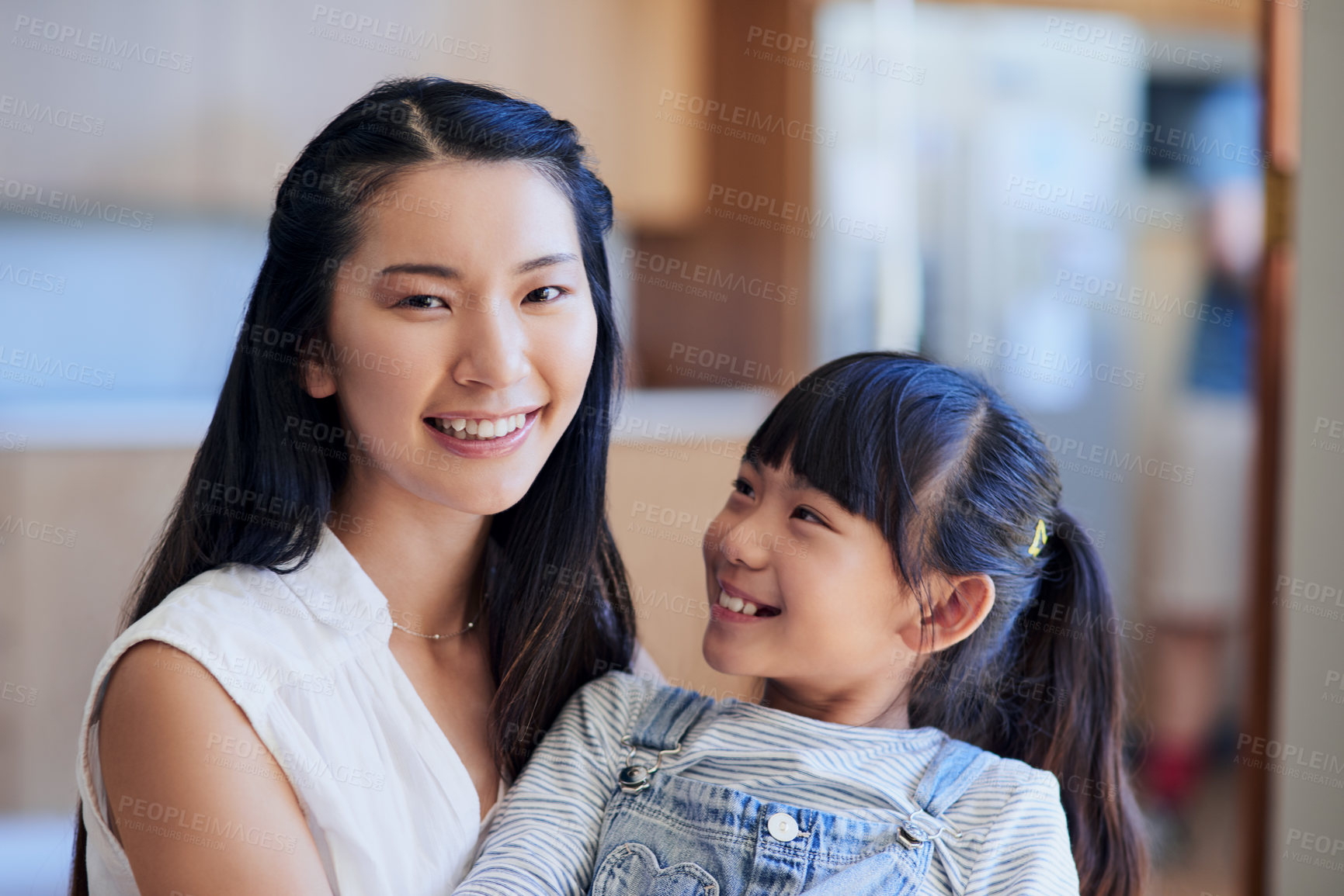 Buy stock photo Portrait of a mother and her little daughter bonding together at home