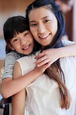 Buy stock photo Portrait of a mother and her little daughter bonding together at home