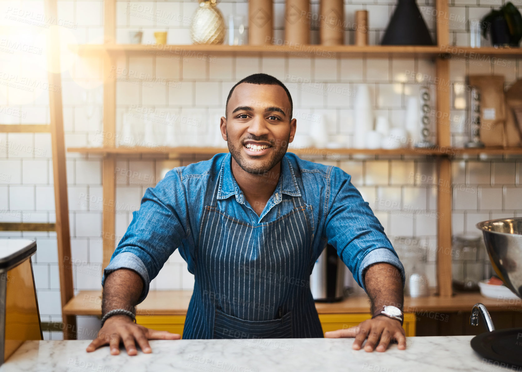 Buy stock photo Coffee shop, counter and portrait of black man in restaurant for service, working and welcome in cafe. Small business owner, barista startup and happy male waiter smile in cafeteria ready to serve