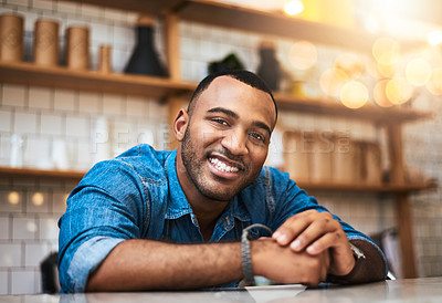 Buy stock photo Cropped portrait of a handsome young man standing in his coffee shop