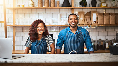 Buy stock photo Cropped portrait of an affectionate young couple standing in their coffee shop