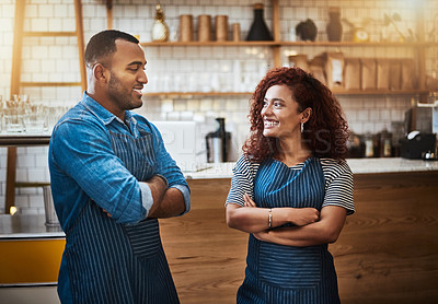 Buy stock photo Coffee shop, couple and smile of barista with arms crossed at restaurant or startup. Confident waiter, happy man or woman together in cafe for partnership, teamwork or pride with small business owner