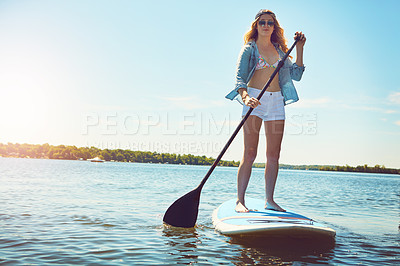 Buy stock photo Portrait, paddle and woman with surfboard, travel and stress relief with hobby, getaway trip and break. Face, person and girl with water, summer holiday or vacation with adventure, fitness or journey