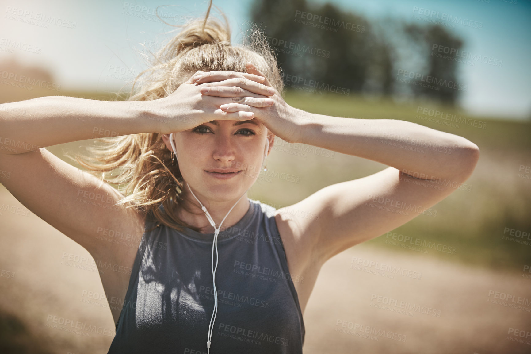 Buy stock photo Portrait of a young woman taking a break while out for a run